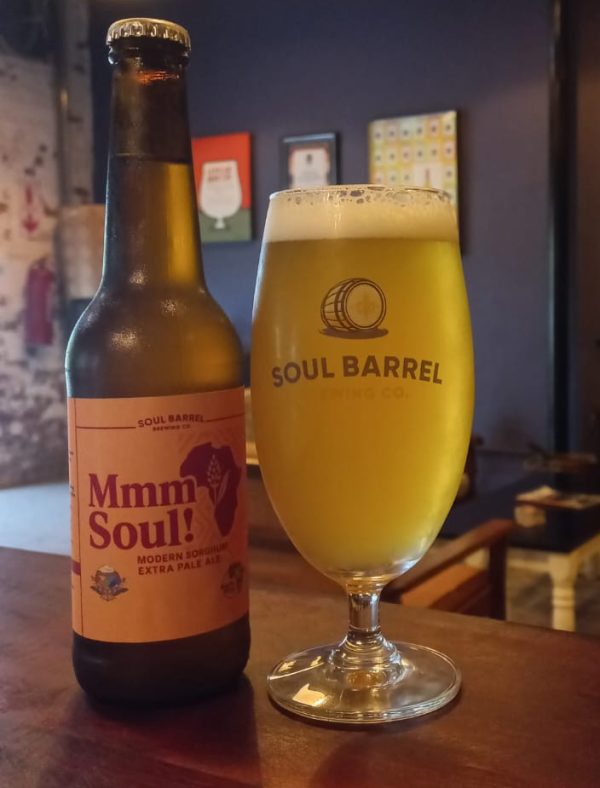 Mmm Soul sorghum beer bottle and poured glass on display
